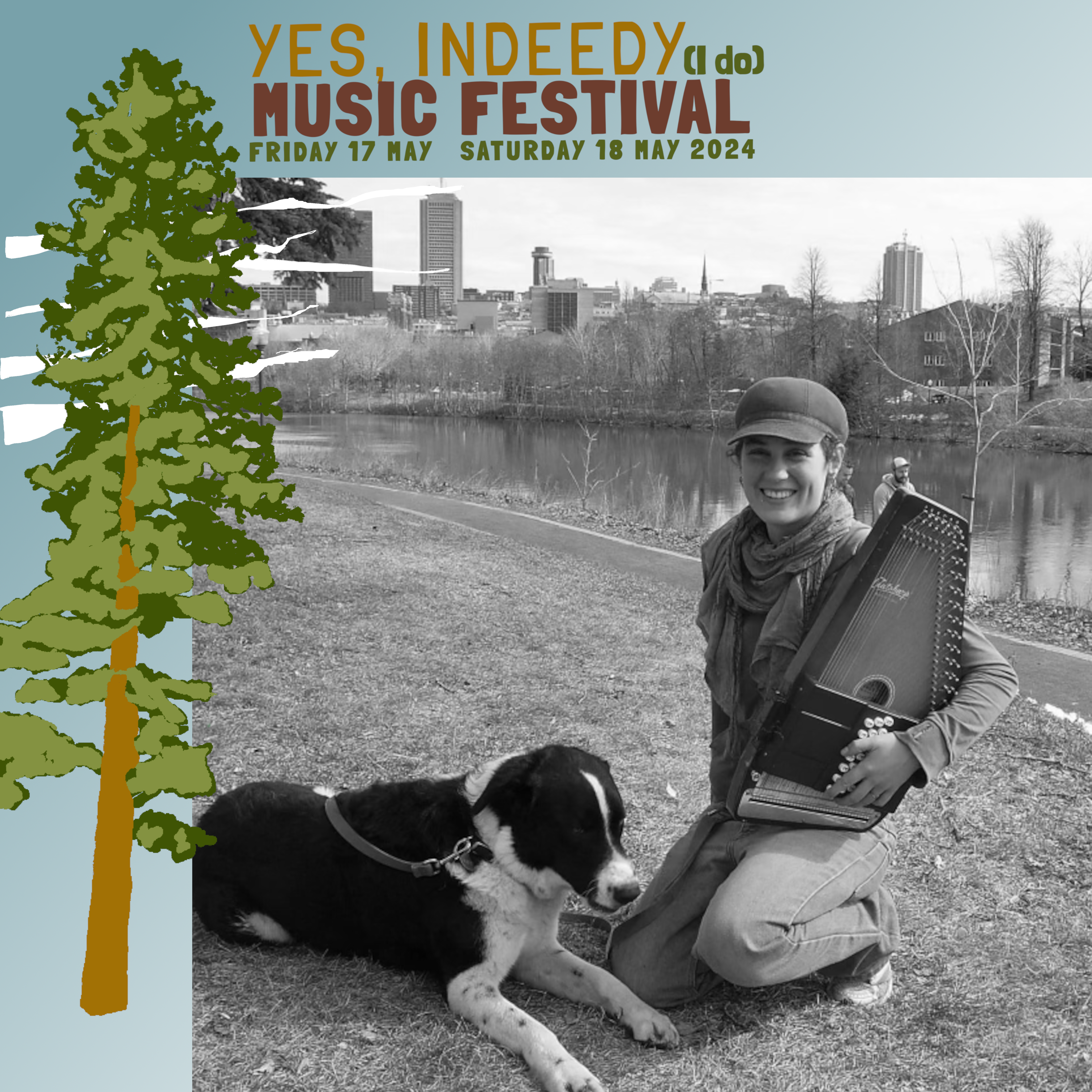 A black and white photo of artist Anne Hedonia who is smiling and kneeling in the grass while holding an autoharp in the crook of their left arm. To their right is a black and white dog laying down in the grass with its front paws outstretched.  In the background is a body of water, followed by some trees and then a city skyline. The photo of Anne Hedonia is framed by a blue border with “Yes Indeedy (I do) Music Festival Friday 17 May Saturday 18 May 2024” written at the top and the image of a green and brown coniferous tree to the left.